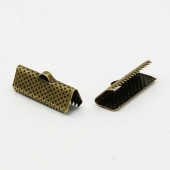 100 unidades.Terminal metal  color bronce 20x8x5mm, agujero 2mm